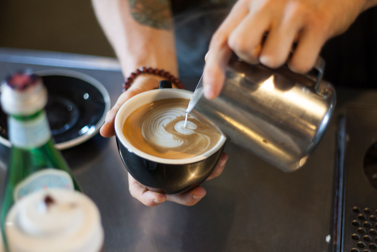 A latte poured into a ceramic cup